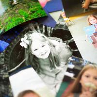 Photos of Audrey scattered on a table