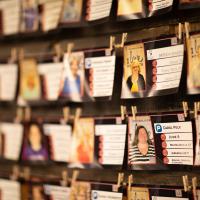 A series of images suspended on a clothesline with pins