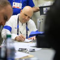 Dr. Adkins and his team fill out paperwork and prepare for an event.