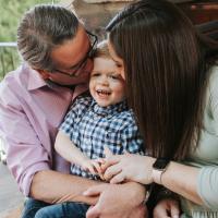 Dr. Johnson and Kelsey both give Kelsey’s son a kiss on either side of his face.