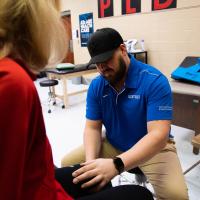 Donna works with her physical therapist on her knee.