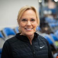 Donna smiles while at a pickleball game.