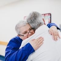 Kelly Kampmann, RN, gives Dr. McLarney a hug. She was responsible for Dr. McLarney’s recovery care.