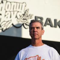 Fred stands in front of the Donut Days bakery.