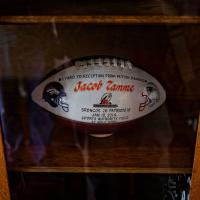 A special football is displayed in a case that says \