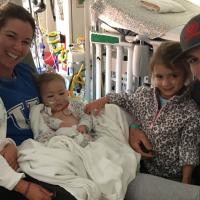 A selfie of the Shaughnessy family in the hospital gathered around baby Kailey who is in her mother’s arms.