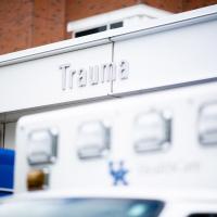 The entrance to the Trauma unit at UK HealthCare. Ambulances are parked in front of it.