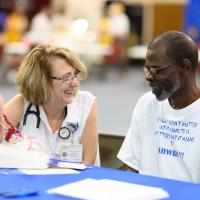 Margie educates a Kentuckian on the symptoms of stroke.