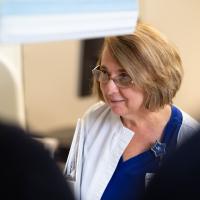 Margie smiles at another nurse.