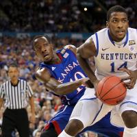 An action shot of Michael mid-dribble during a University of Kentucky basketball game.