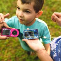 Max and Kara show off their glucose monitors and insulin pumps.