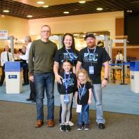 Izzy and her family pose for a photo before entering Rupp Arena for Excite Night.