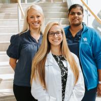 A photo of Dr. Vasireddy, Dr. Ignaszewski, and another doctor together posing together on a staircase in the hospital.