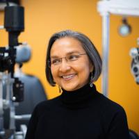 Dr. Capoor smiles in one of her vision examination rooms.