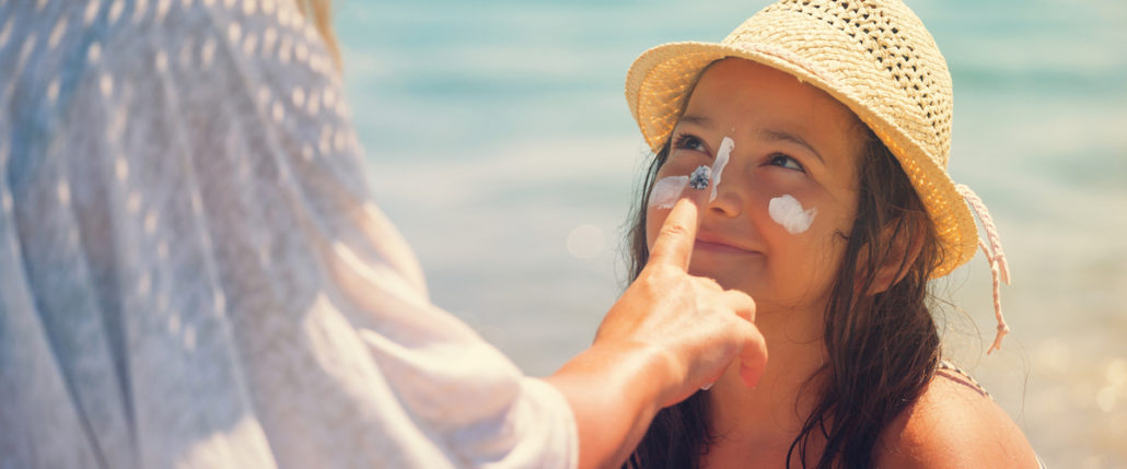 Little girl with sunscreen on her face