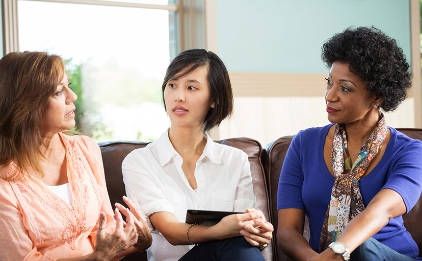 Three women talking.