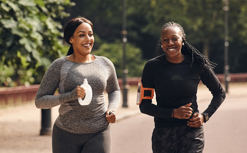 Two women running in the park.