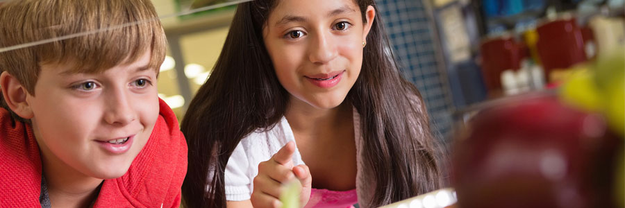 Two young athletes make a food selection.